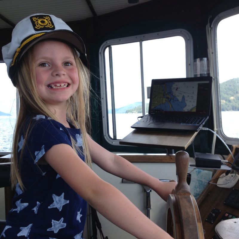 Alisa Kozhikina sitting on top of a car window