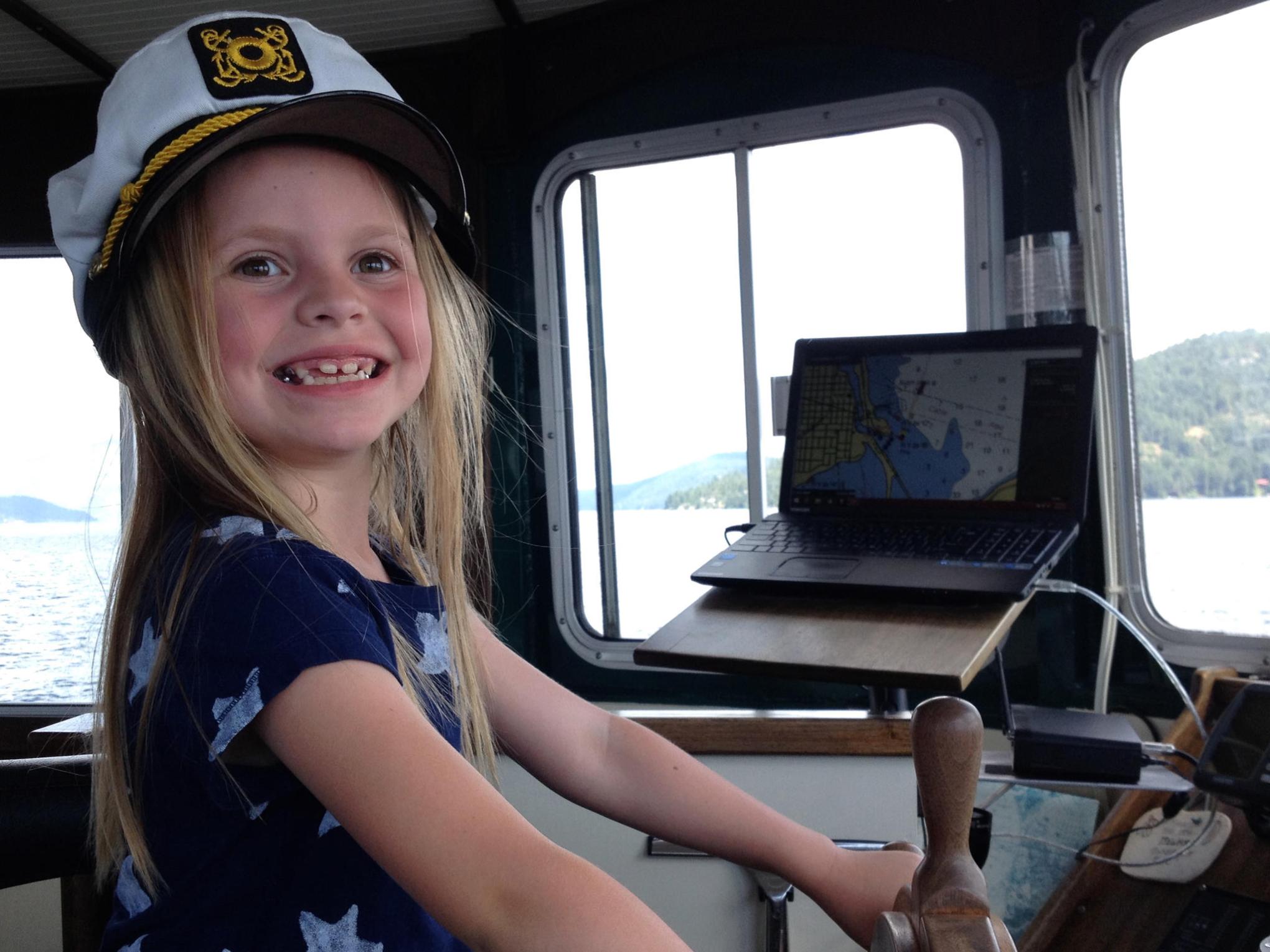 a person sitting on top of a car window