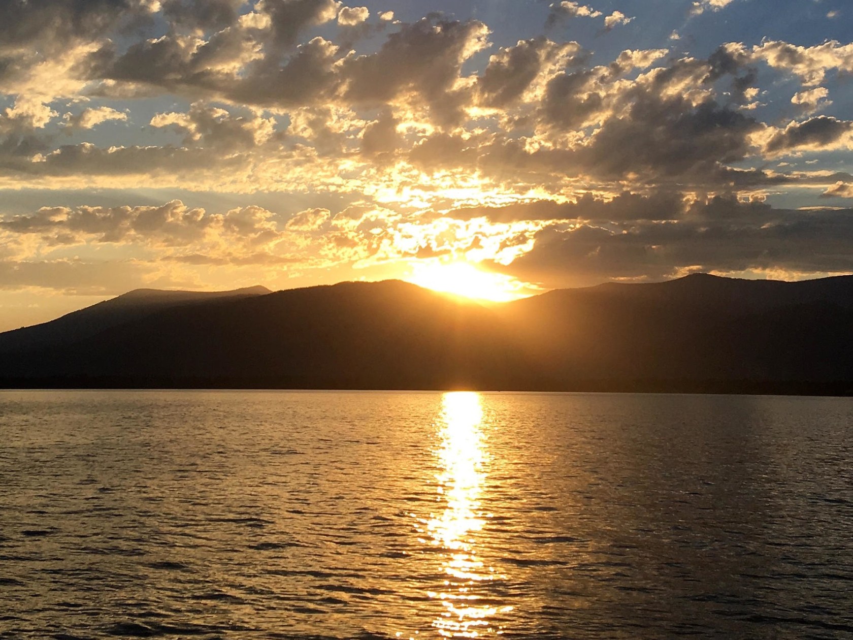 a sunset over a body of water